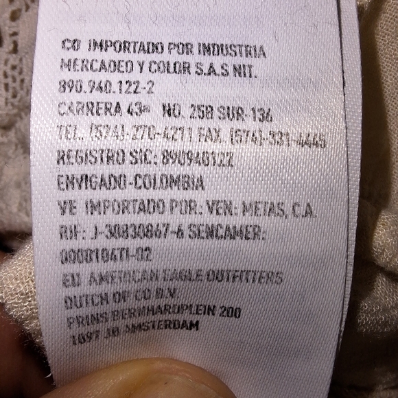 An American Eagle sheer and lace low-cut blouse in a size medium. - Picture 8 of 9